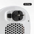 White ceramic electric heating blower with remote control on table