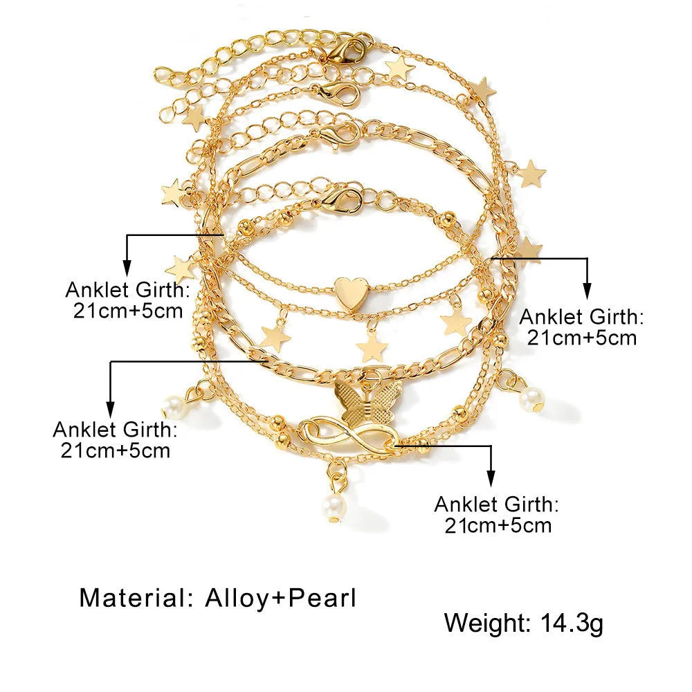 Set of four alloy anklets with butterfly, pearl, and heart designs on a white background.