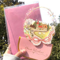 Handmade 3D boxed greeting card with butterfly shape, hot stamping, and artificial flowers on coated paper.