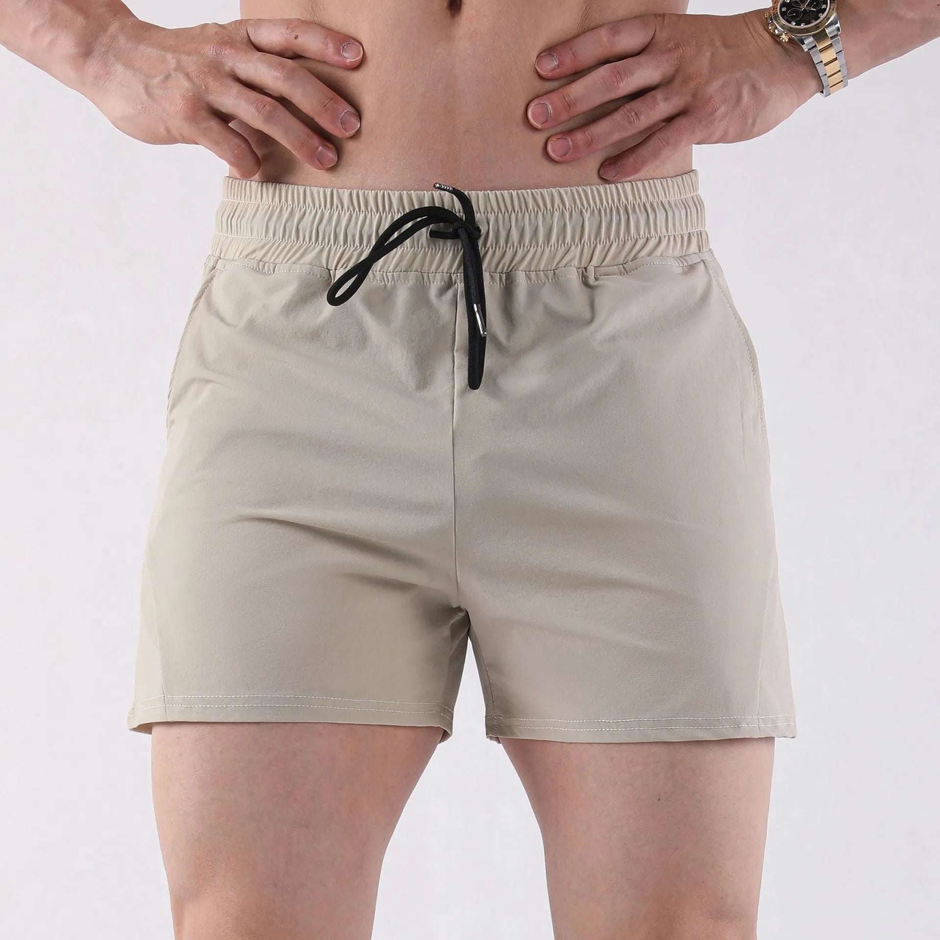 Men's thin grey basketball shorts made from polyester with an elastic waistband.