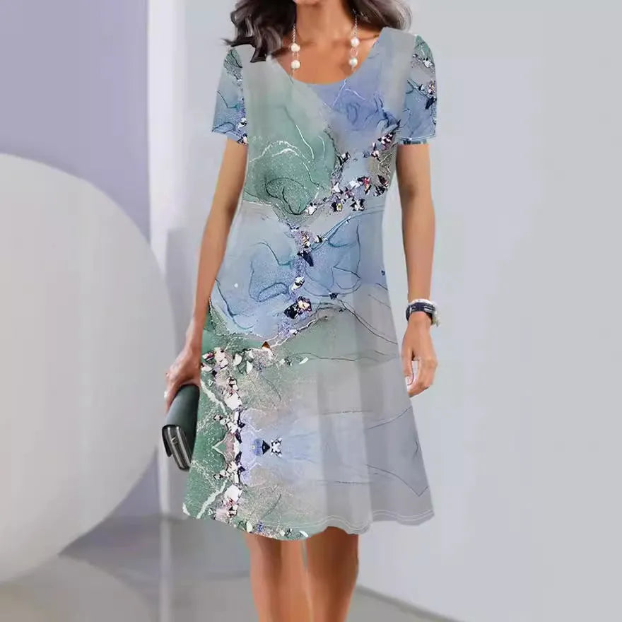 Light blue floral print A-line summer dress with short sleeves and round neck.