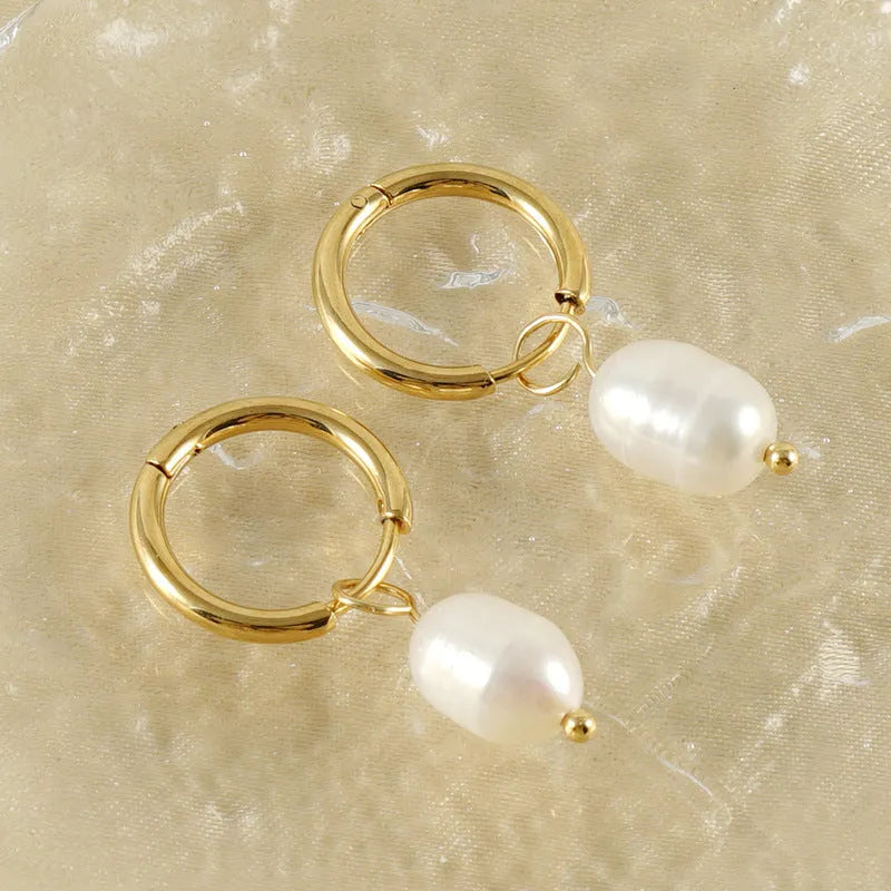 Gold geometric women's earrings with freshwater pearls on stainless steel and titanium posts.