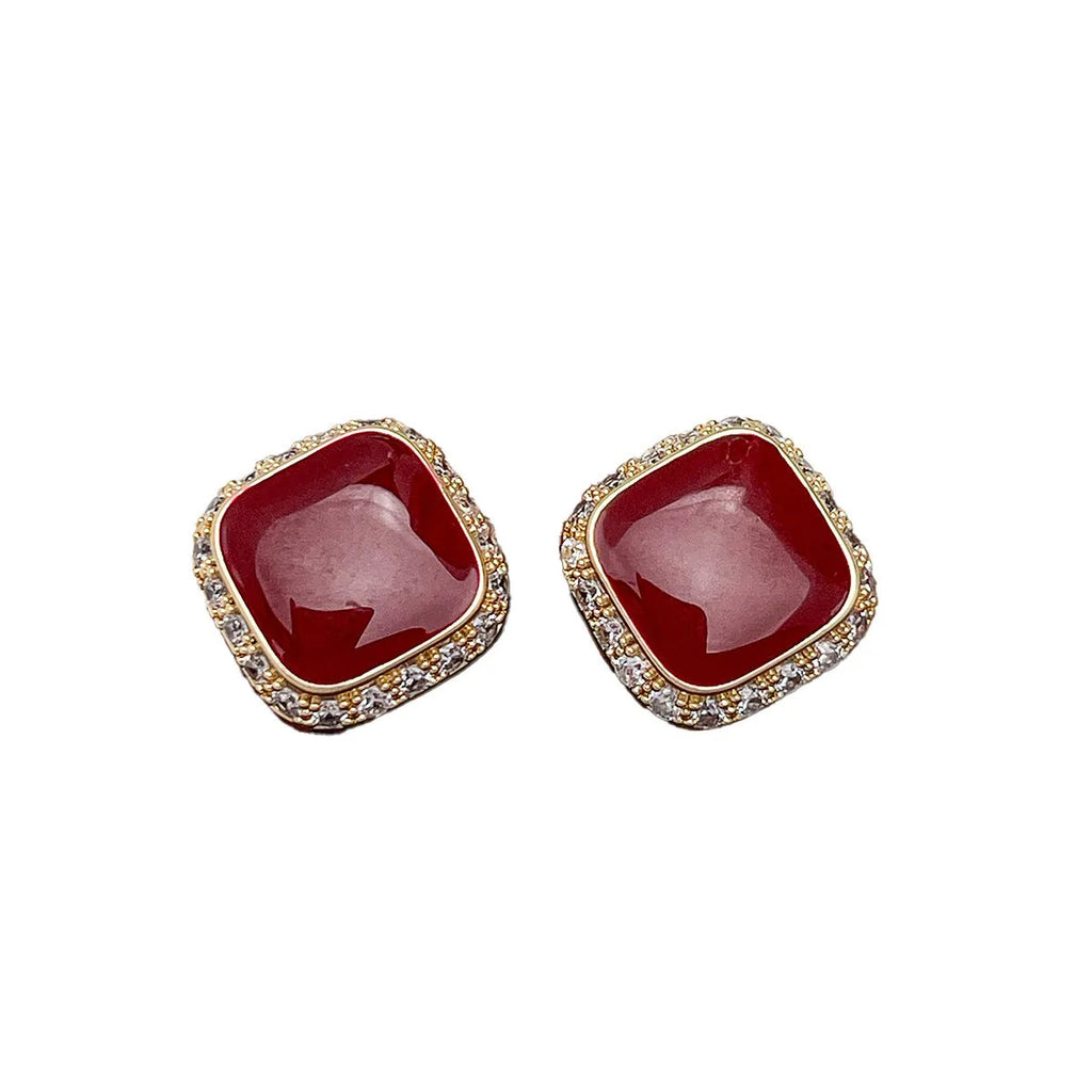 Red square plate earrings with geometric alloy construction and retro styling