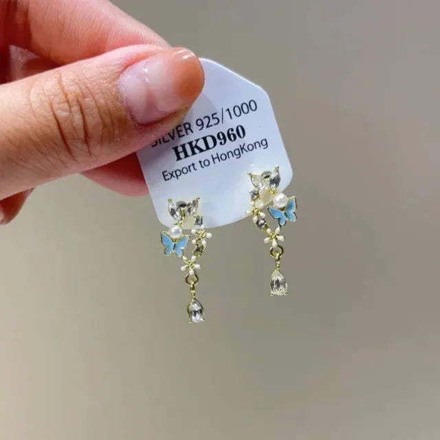 Women's geometric heart-shaped alloy ear clip earrings with rhinestone stars and tassels