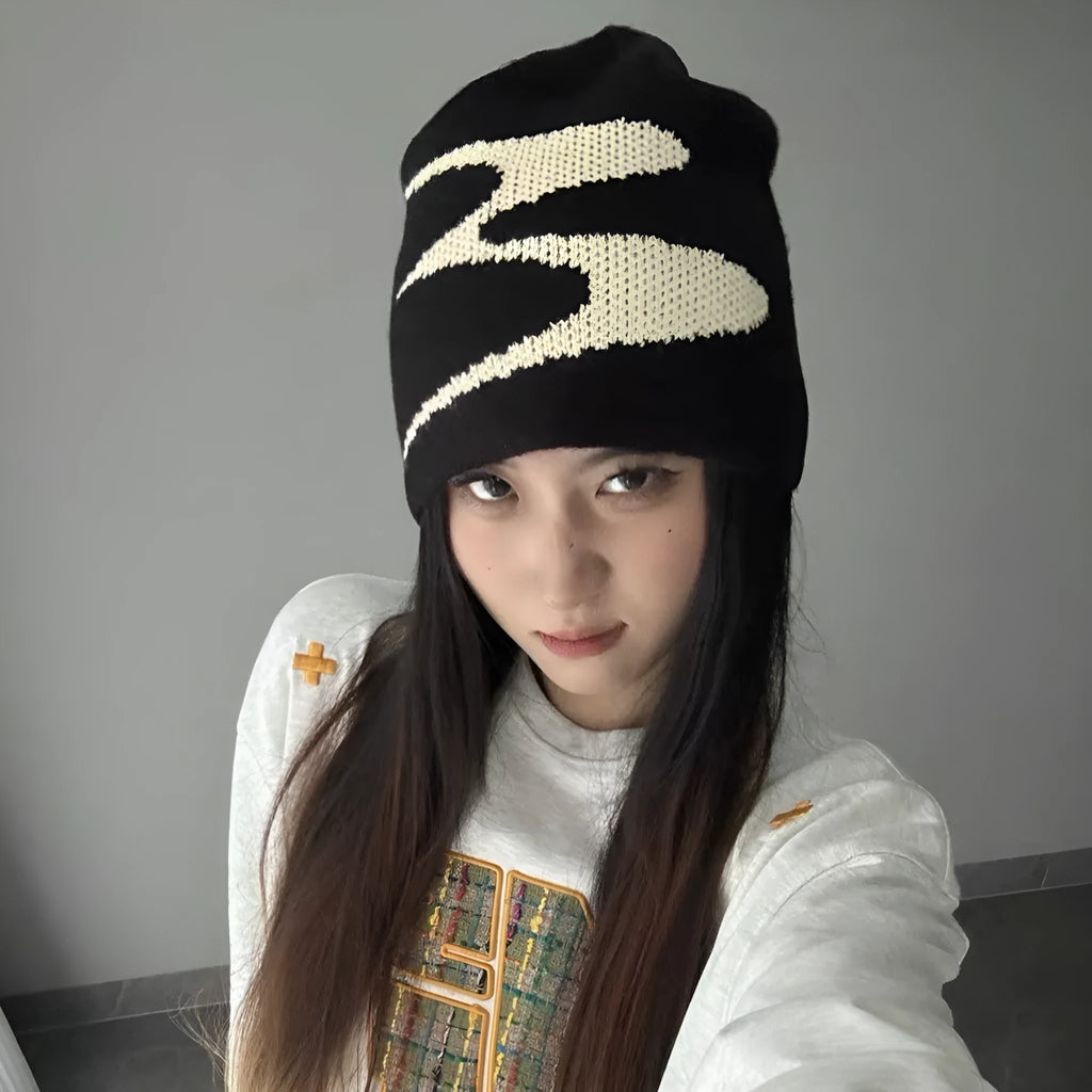 Acrylic thermal knit beanie hat in black, shown on a model, illustrating its textured anti-fall design.