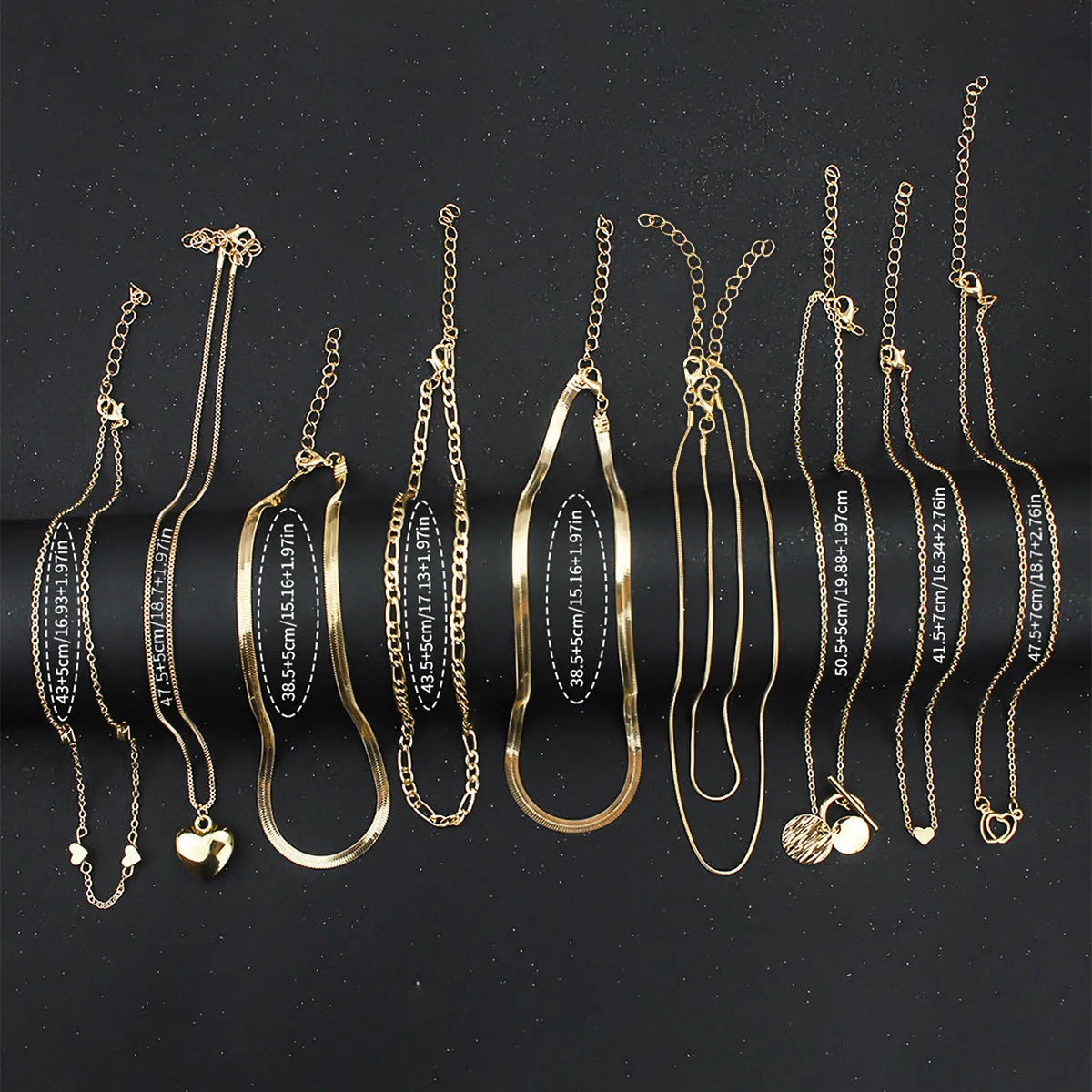 Ten-piece gold women's necklace set with adjustable snake bone chains and alloy pendants
