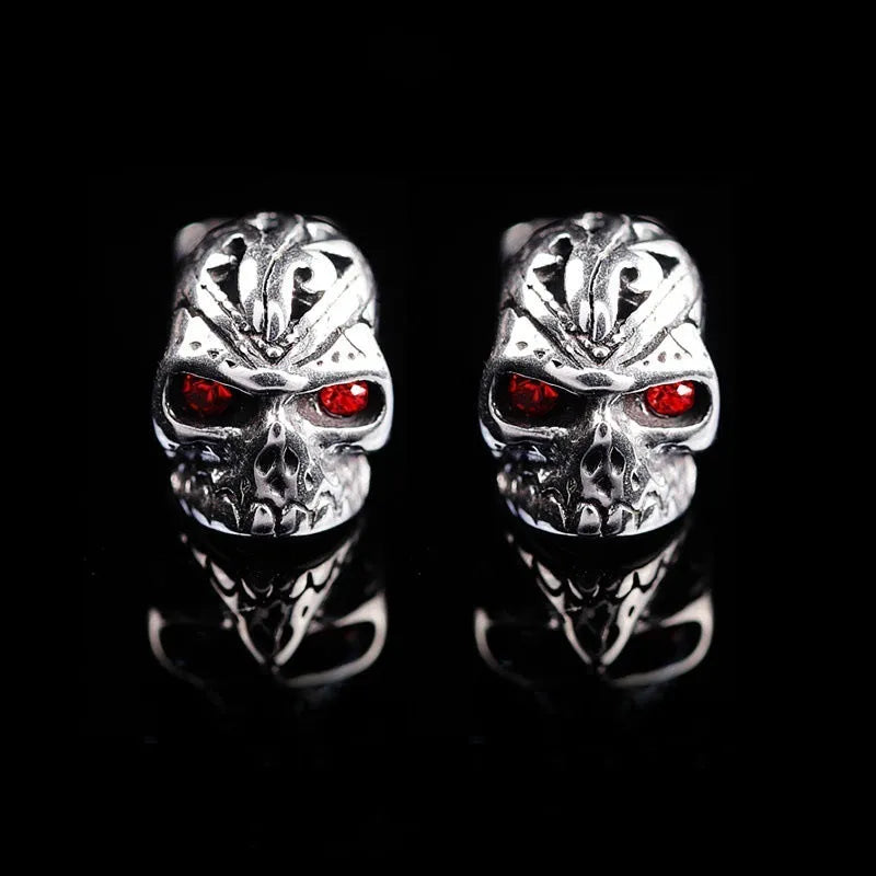 Red eye ghost head skull stud earrings with electroplated alloy construction and artificial gemstone details