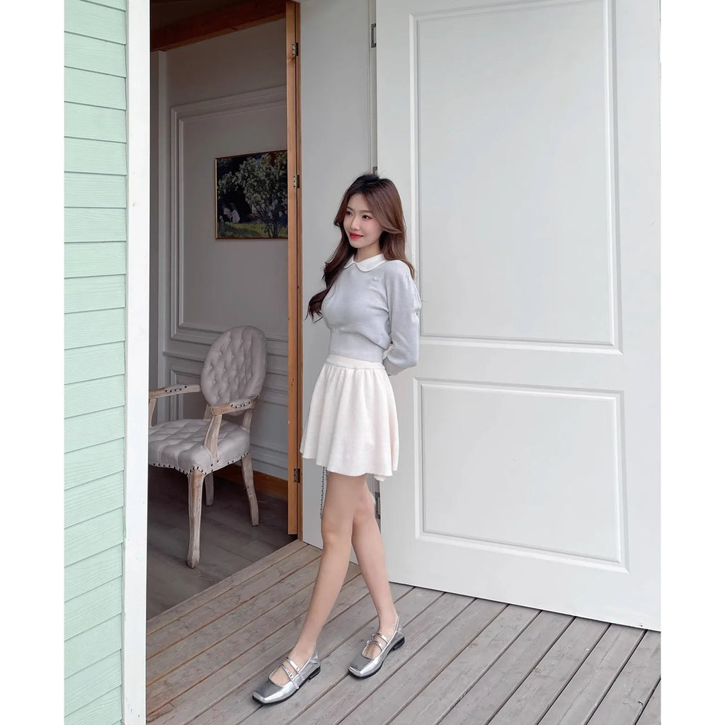 Women's silver genuine leather Mary Jane shoes with a cross buckle strap and flat low heel.