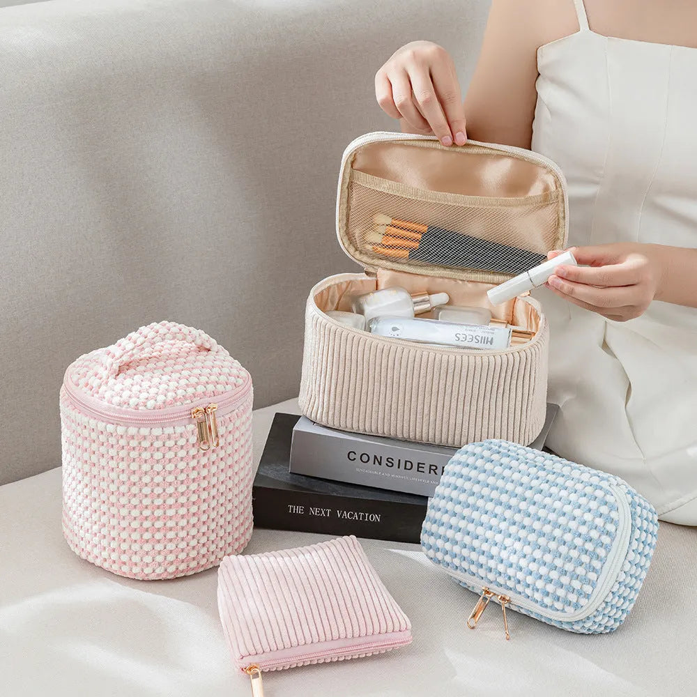 Four cube-shaped flannelette makeup bags in matching blue with dots design