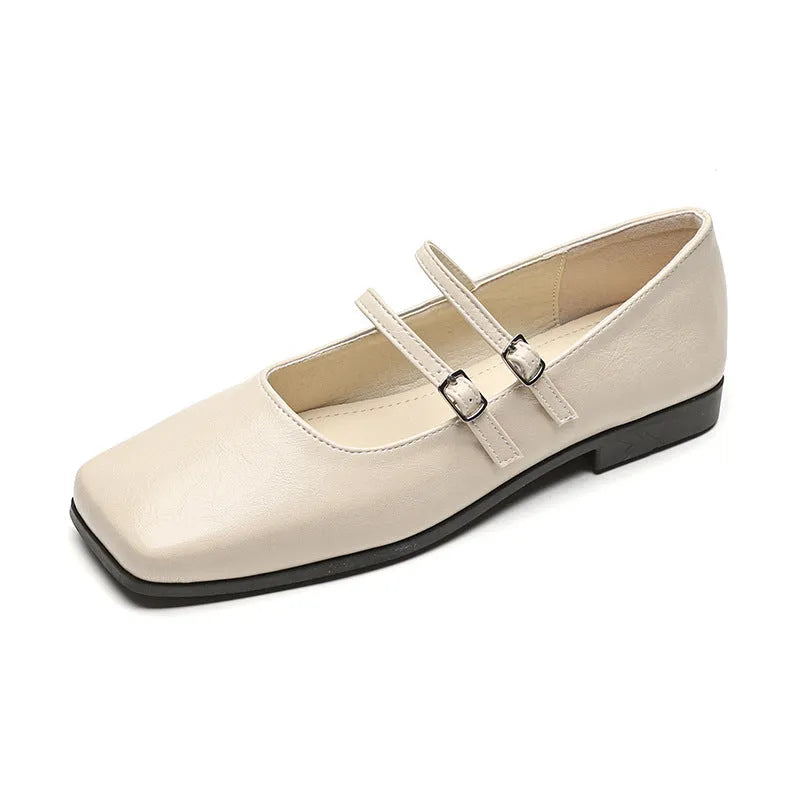 Women's silver genuine leather Mary Jane shoes with a cross buckle strap and flat low heel.