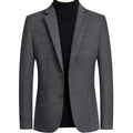 Men's solid colour slim fit wool suit jacket on a hanger in grey, black, or camel.