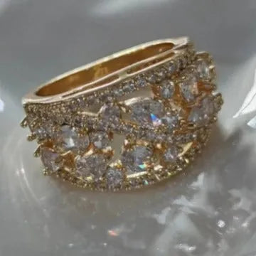 Women's round hollow copper fashion ring with simulated gemstones in gold or platinum plating options