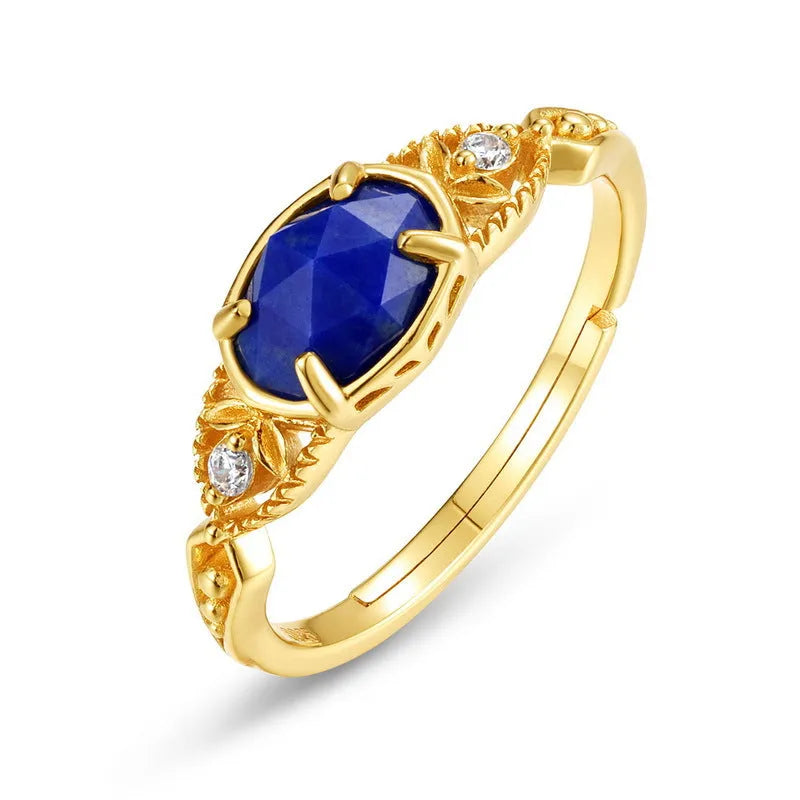 Women's oval geometric ring with blue lapis lazuli stone on a silver-coloured alloy band.