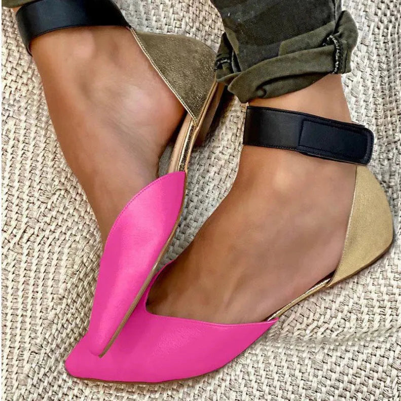 Women's beige casual sandals with Velcro straps and a hollowed pattern on a flat heel.