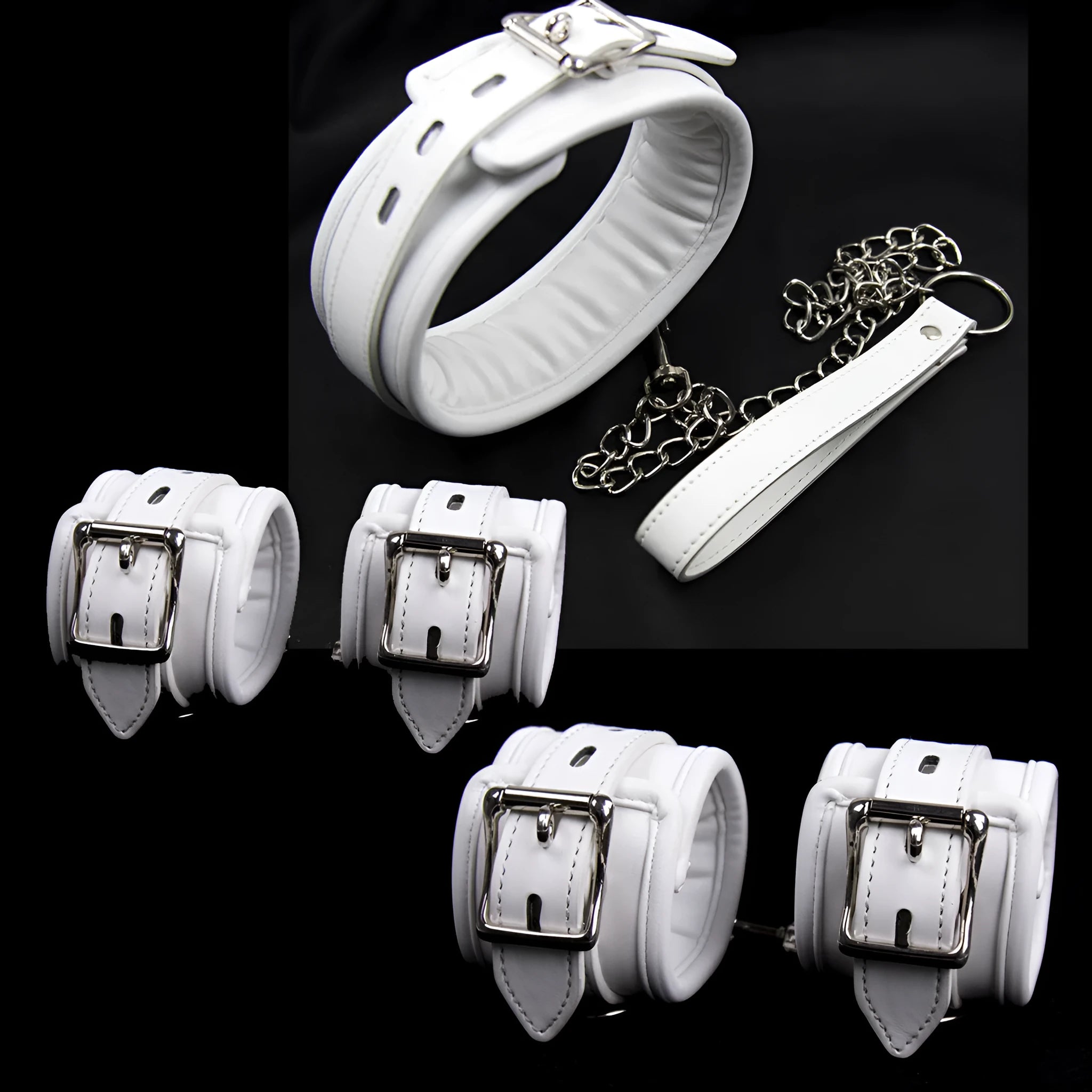 White PU sponge bondage set showing handcuffs, foot cuffs, and neck scarf arranged together