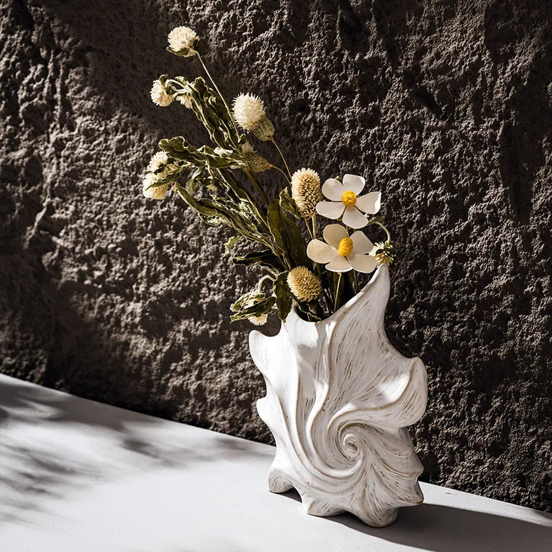 A European style retro ceramic vase with a coloured glaze finish, shown on a shelf.