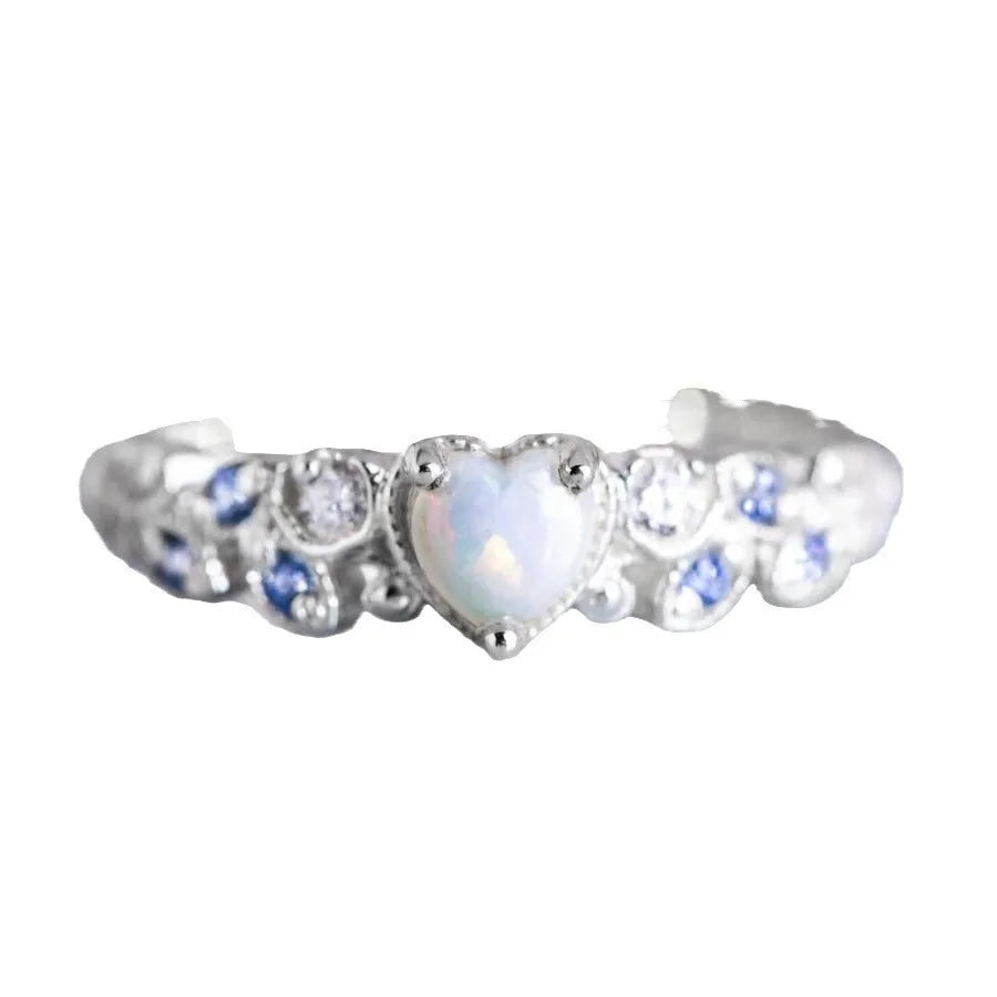 White alloy women's heart ring with floral opal ocean design, shown in multiple available sizes