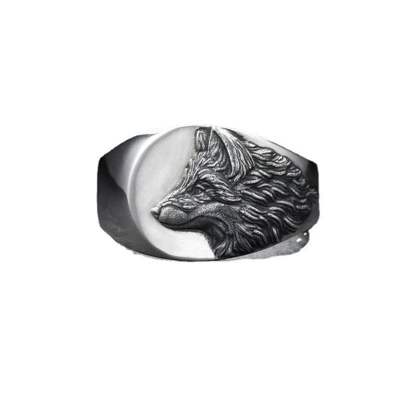 Close up of men's silver alloy ring featuring a geometric wolf head design in retro style