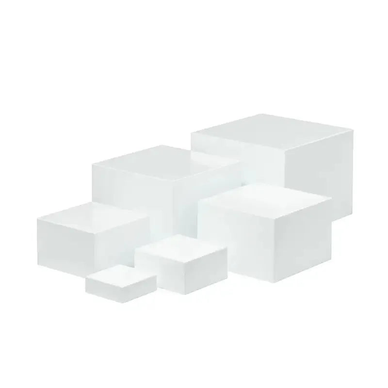 White plastic stackable dessert display stand with six pieces arranged in tiered formation