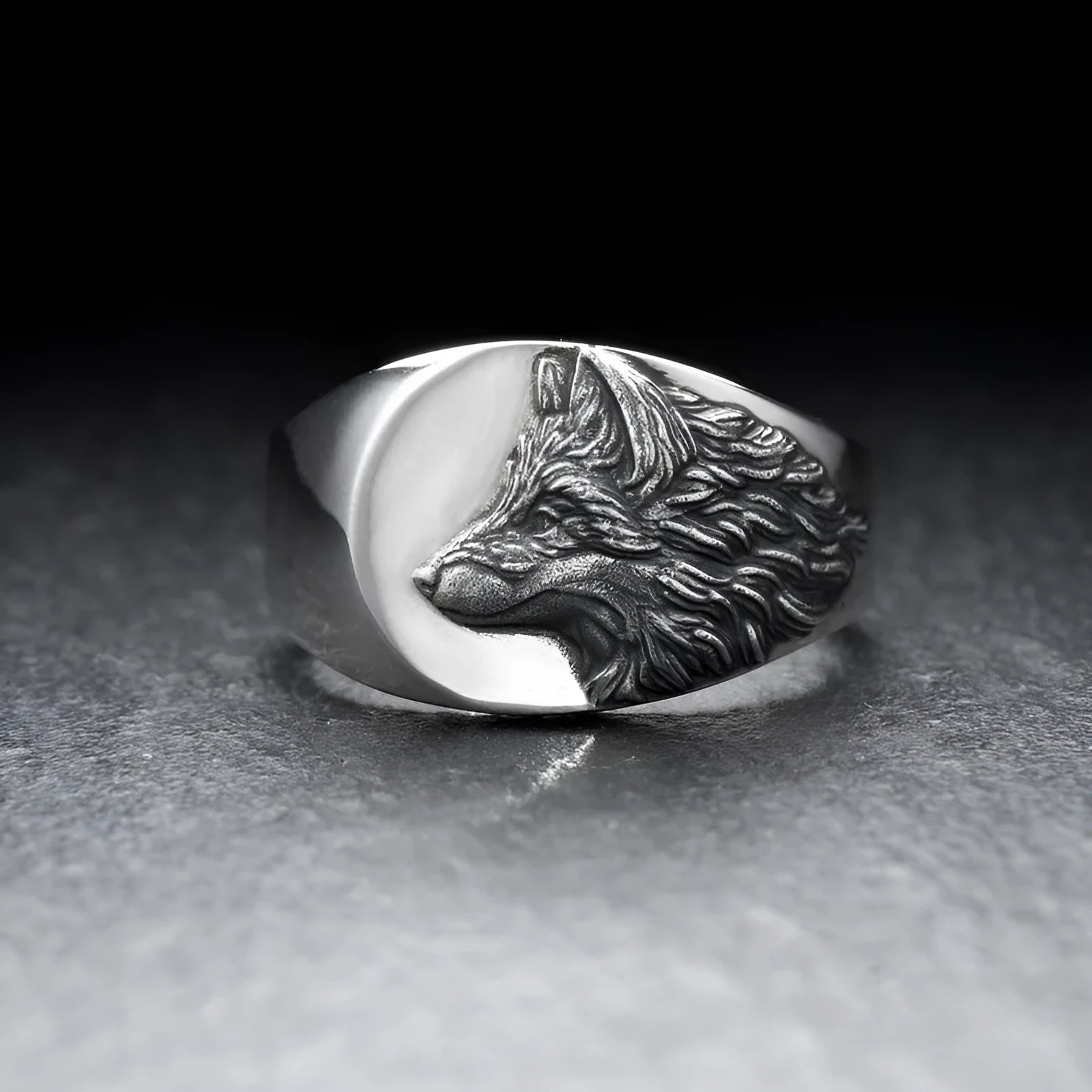 Close up of men's silver alloy ring featuring a geometric wolf head design in retro style