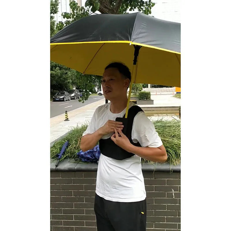 Black portable umbrella holder with a fixed shoulder strap, made from diving cloth, shown holding a manual umbrella.