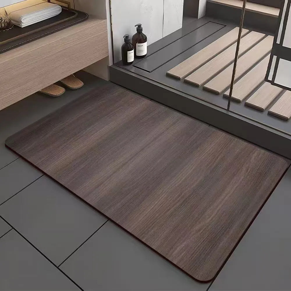 Square diatomite bath mat with a geometric wood grain pattern in a bathroom setting.