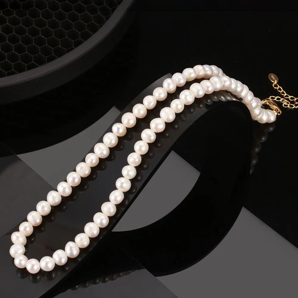 Adjustable women's necklace with natural freshwater pearls on sterling silver chain