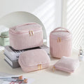 Four cube-shaped flannelette makeup bags in matching blue with dots design