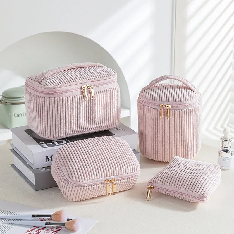 Four cube-shaped flannelette makeup bags in matching blue with dots design