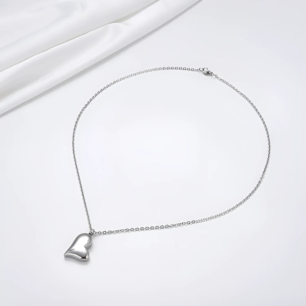 Silver curved peach heart stainless steel pendant necklace on a chain