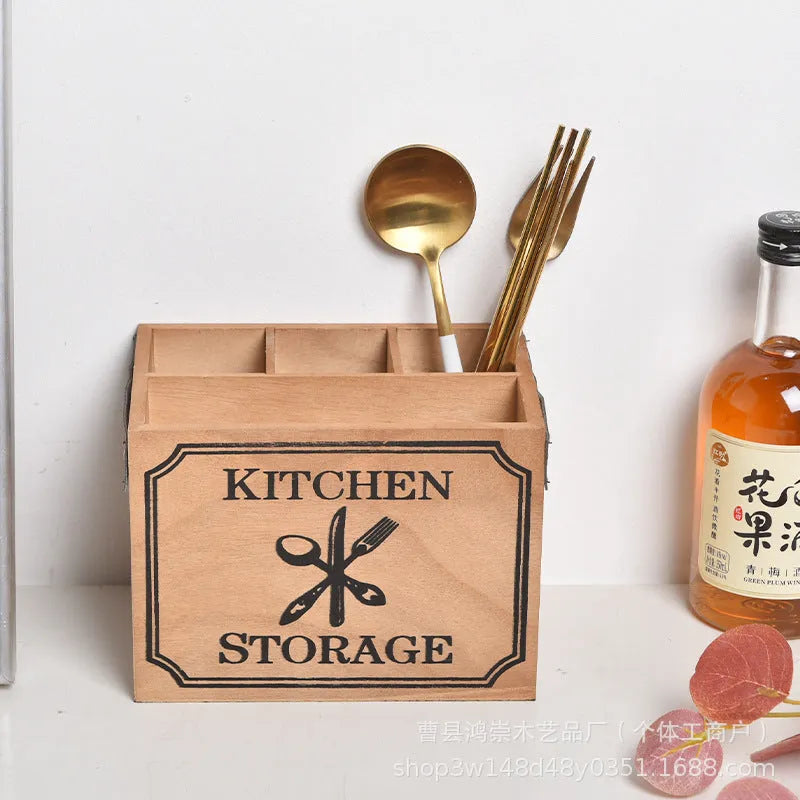 Open-top wooden kitchen storage box with internal grid divider for knives, forks, and chopsticks.