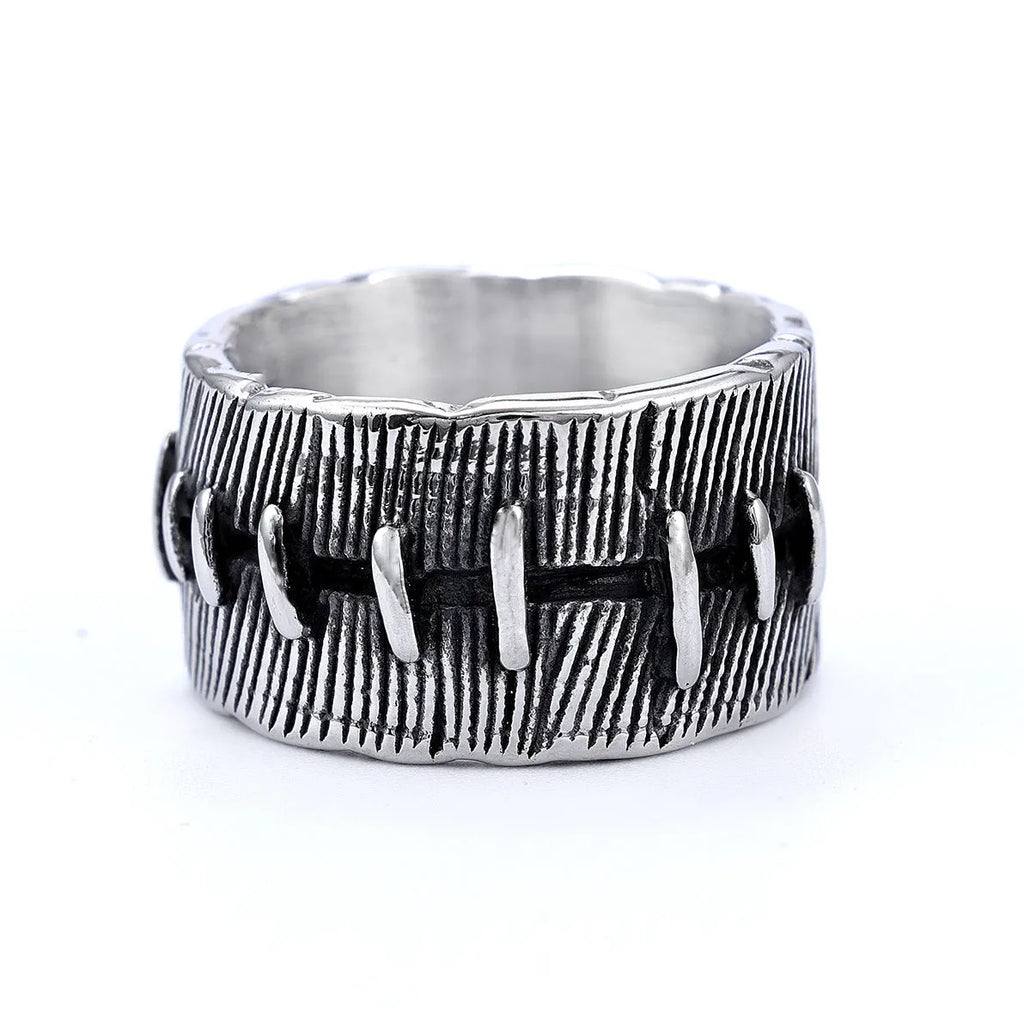 Geometric titanium steel double ring in a dark punk style with a U-shape and stitched design.