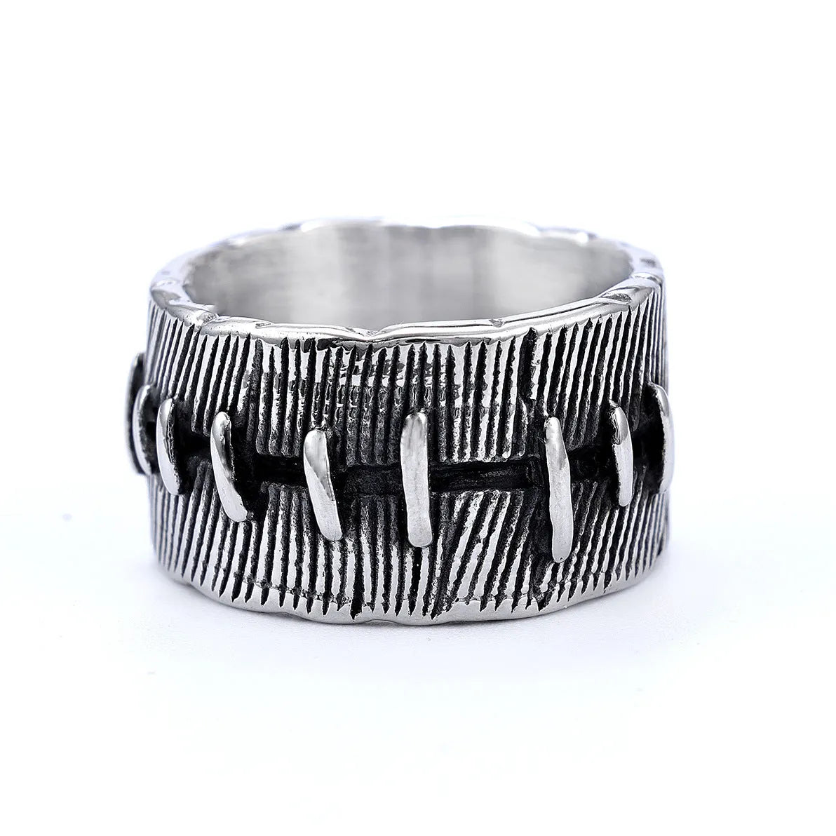 Geometric titanium steel double ring in a dark punk style with a U-shape and stitched design.