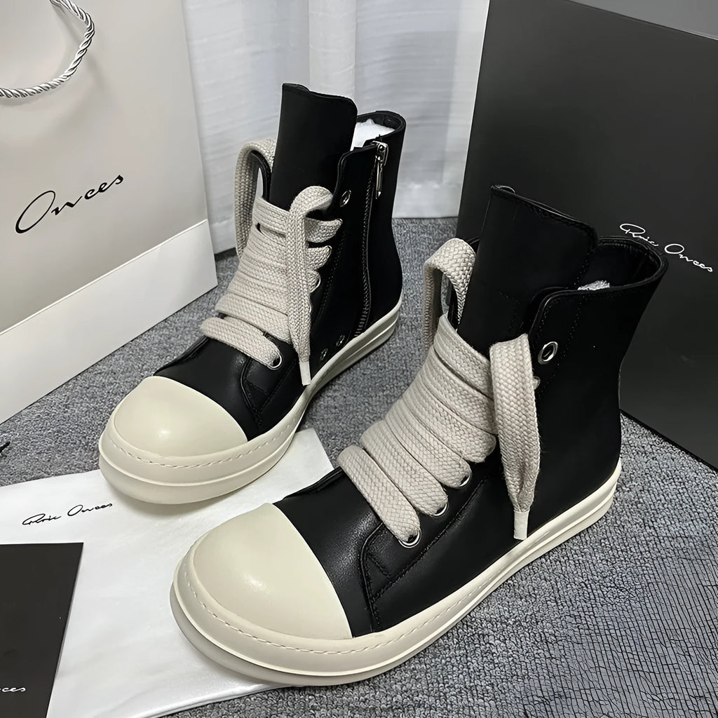 Black genuine leather high-top sneakers with a side zipper on a mid-heel platform sole.