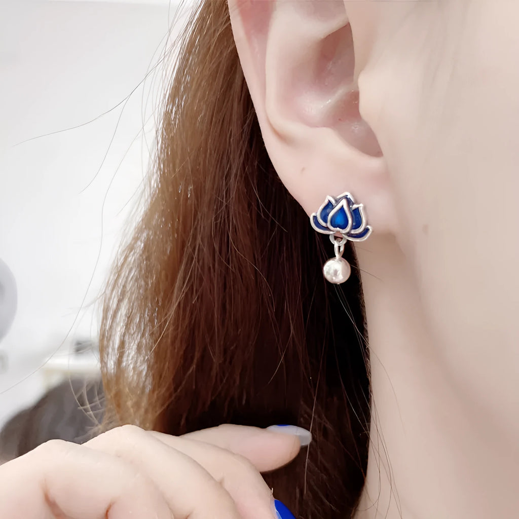 Blue lotus flower stud earrings with a detailed seedpod tassel drop, retro design.