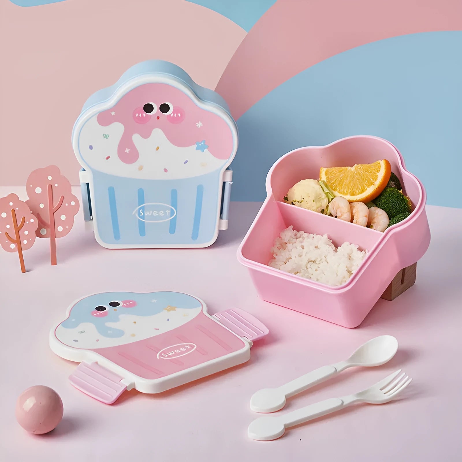 Pink and blue creative ice cream shaped plastic lunch box with bento compartment, spoon, and fork.