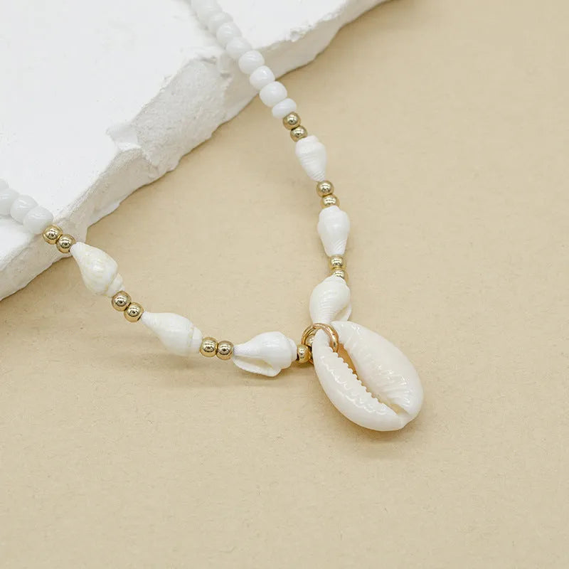 White conch shell necklace with mother of pearl pendant on silver electroplated chain