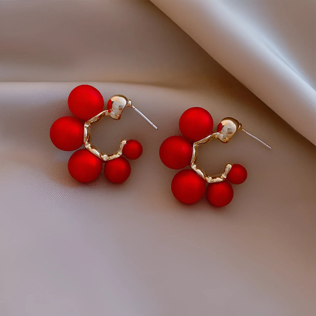 Red bell-shaped drop earrings for women with alloy construction, shown in red and white colour options
