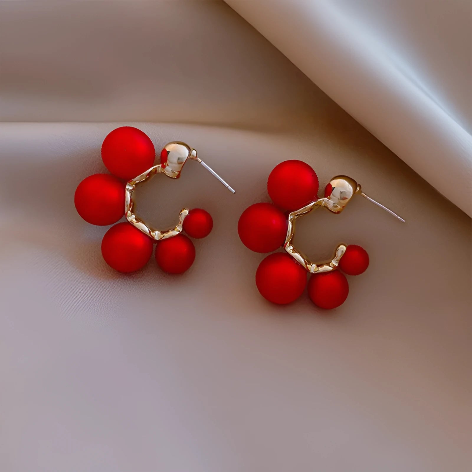 Red bell-shaped drop earrings for women with alloy construction, shown in red and white colour options