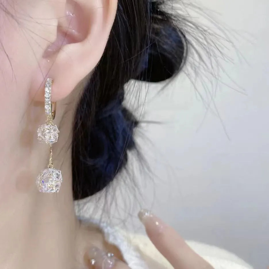 Silver balloon confession tassel earrings with rhinestone ball and drop shape design