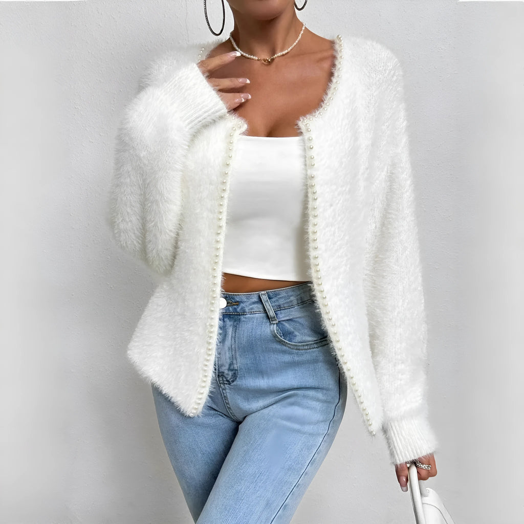 Women's solid white V-neck cardigan with beaded knit detail, shown on a hanger.