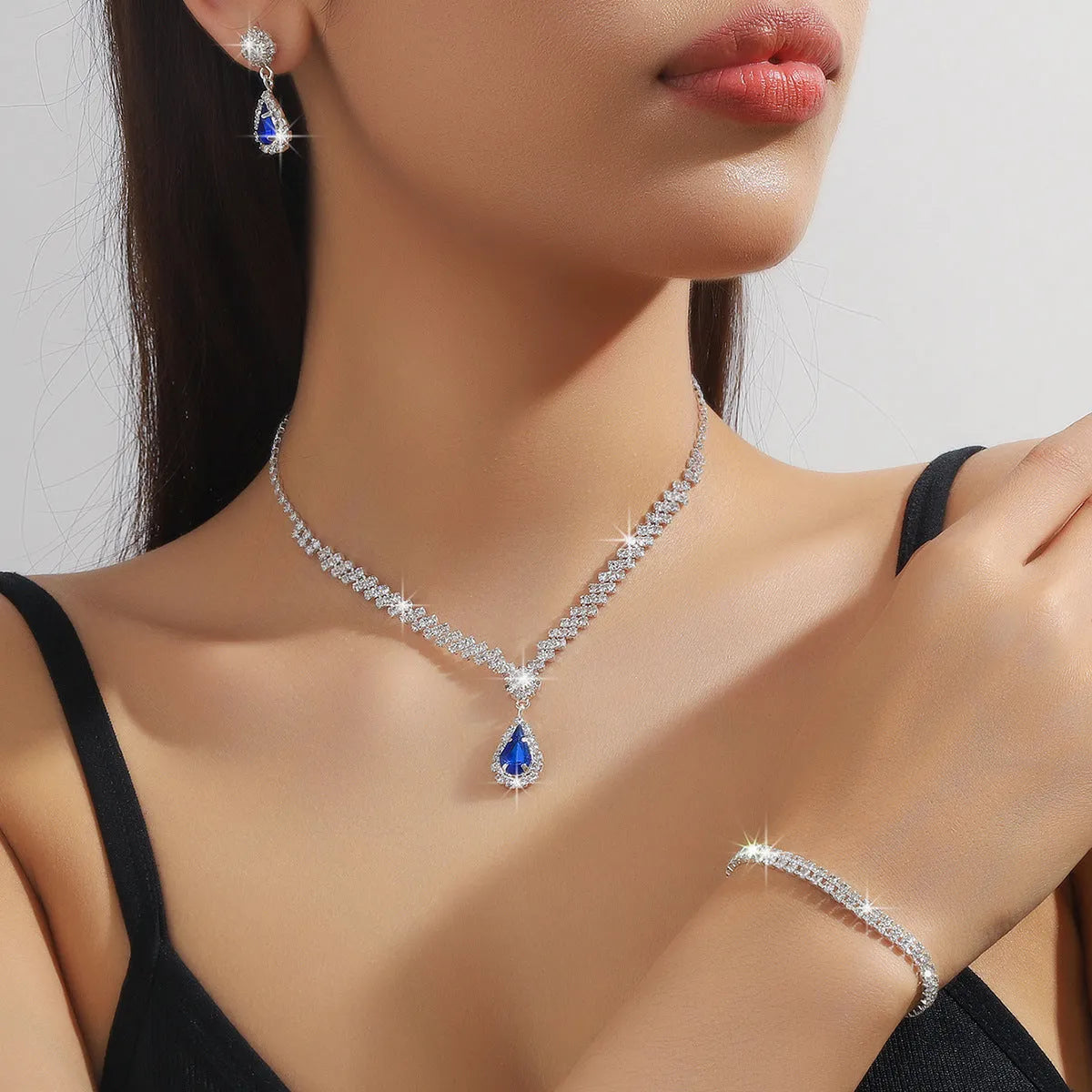Rhinestone claw chain necklace and matching water drop earrings set in selected colour