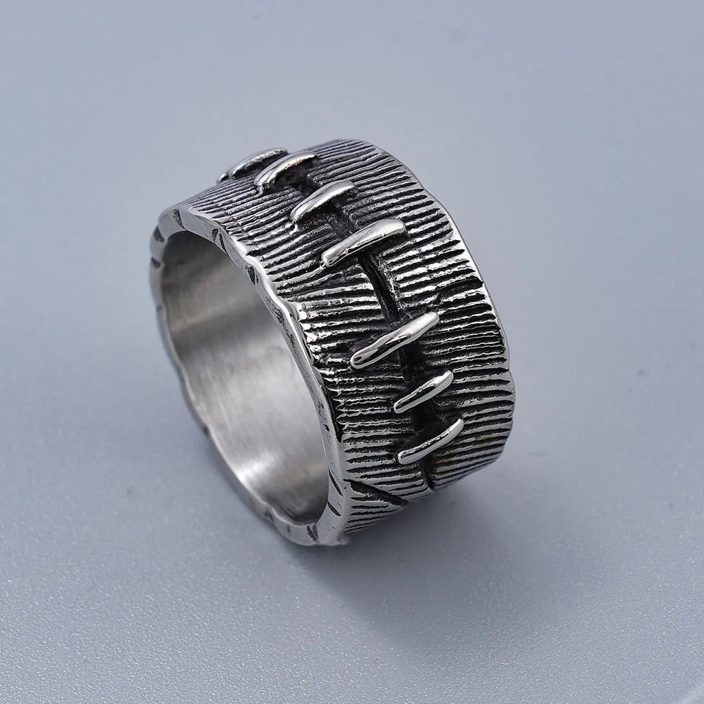 Geometric titanium steel double ring in a dark punk style with a U-shape and stitched design.