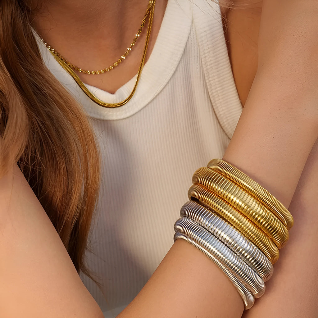Women's elastic titanium steel bracelet with vertical stripe ring pattern in gold colour