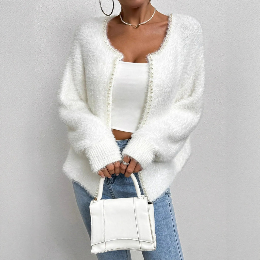 Women's solid white V-neck cardigan with beaded knit detail, shown on a hanger.
