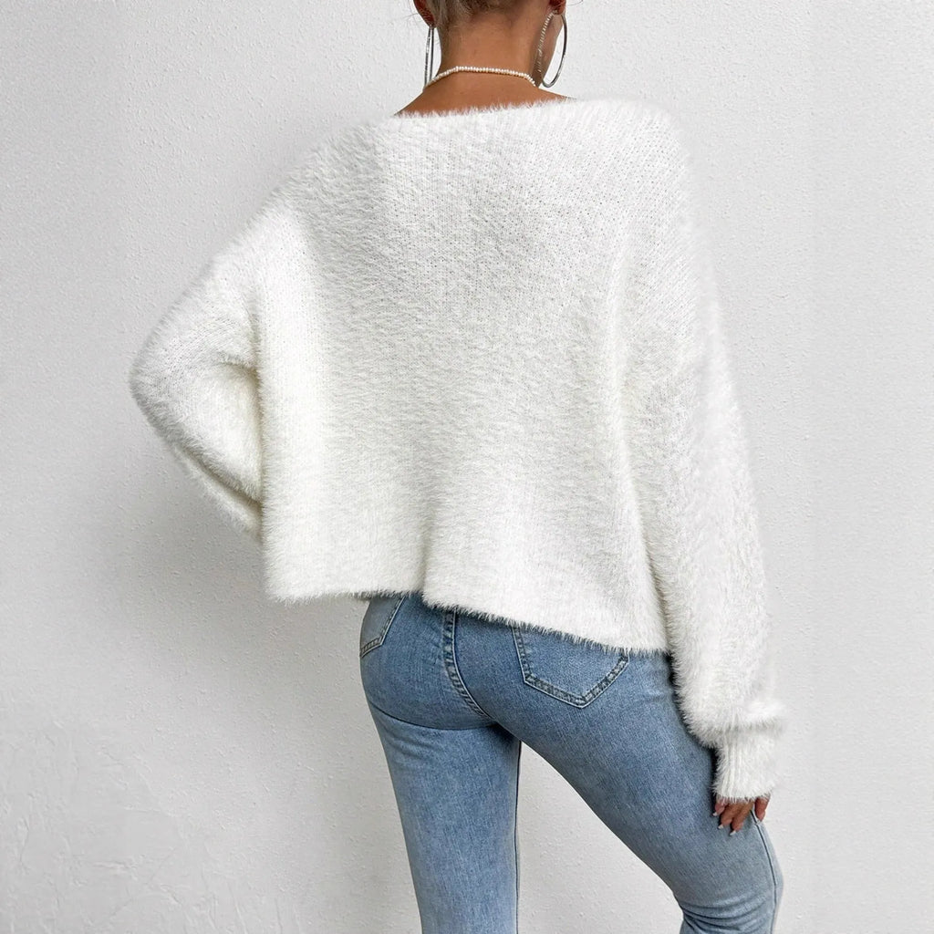 Women's solid white V-neck cardigan with beaded knit detail, shown on a hanger.