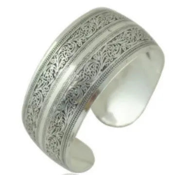 Ethnic carved Miao silver style alloy bracelet in open design with turtle or elephant colour motifs