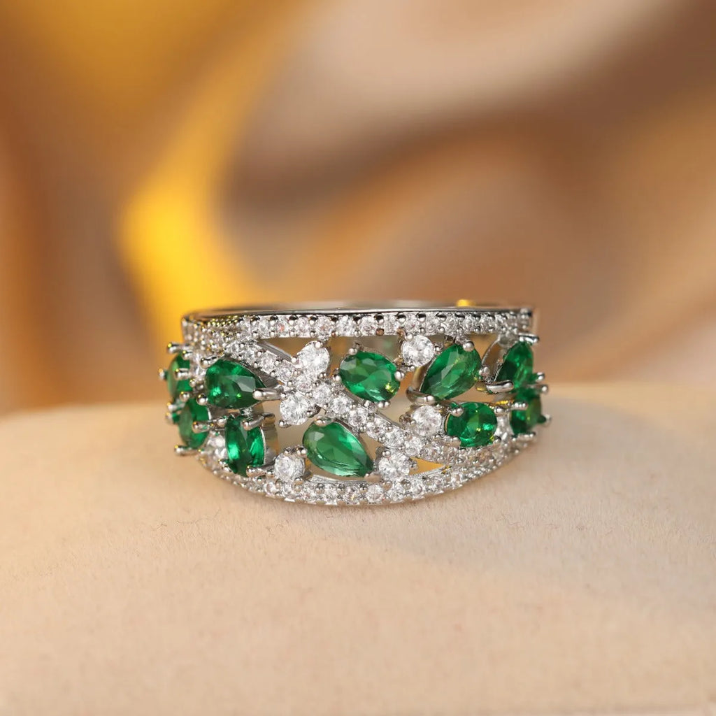 Women's round hollow copper fashion ring with simulated gemstones in gold or platinum plating options