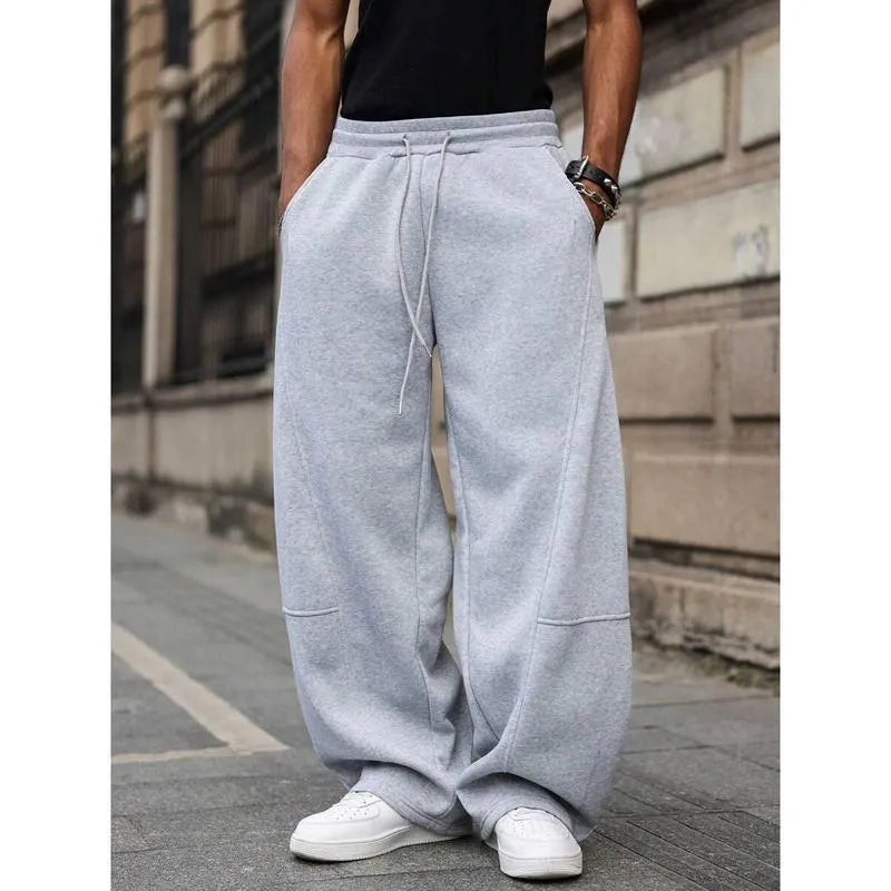 Men's dark grey high-waist straight-leg cropped casual trousers on a hanger.
