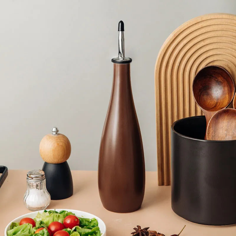 Ceramic oil pot with 650ml conical funnel and integrated oil brush in kitchen setting